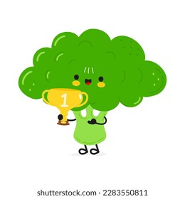 El brócoli gracioso lindo sostiene la copa de trofeo de oro. Caricatura dibujada a mano del vector icono de ilustración del personaje kawaii. Fondo blanco aislado. Feliz brócoli con la copa del trofeo ganador