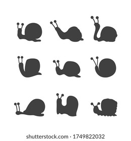 Cute funny cartoon snail black silhouettes collection vector illustration isolated on white background. Set of snails or slugs icons for print and cosmetic products.