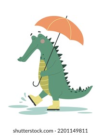 Cute funny crocodile. Alligator in boots holding umbrella and walking through puddles in rainy weather. Design element for printing. Cartoon flat vector illustration isolated on white background