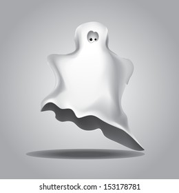 Cute funny Halloween ghost covered with a white coverlet.