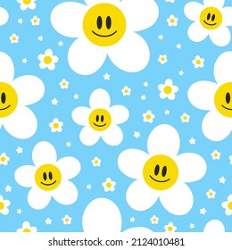 Cute funny kawaii smile smiley face flowers on blue background seamless pattern.Vector cartoon kawaii character illustration design.Positive vintage smile face,camomile flower seamless pattern concept