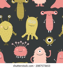 Cute funny monsters. Seamless pattern with cartoon characters on a black background. Vector illustration for printing on fabric, wallpaper, wrapping paper, clothes