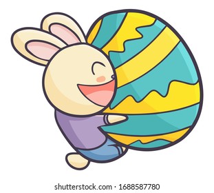 Cute and funny rabbit hugging green easter egg