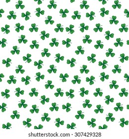 Cute funny seamless background pattern with stylized green clover leaves isolated on the white fond. Vector illustration eps 10
