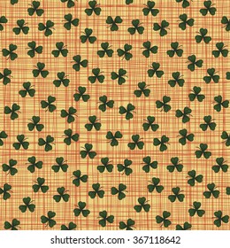 Cute funny seamless background pattern with green clover leaves isolated on the canvas fond. Vector illustration eps