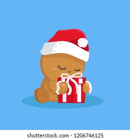 Cute gingerbread hug a red gift box.Chistmas.