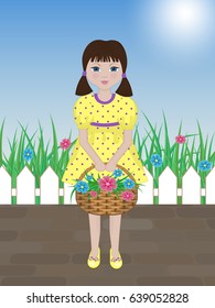 cute girl with a basket of flowers in the garden