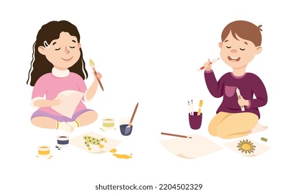 Cute girl and boy sitting on floor painting on paper. Creative kids enjoying of drawing cartoon vector illustration