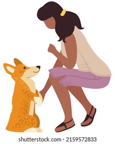 Cute girl character with friendly little welsh corgi. Games and training. Adorable pet dog. Best friends. Woman plays with doggy sitting isolated on white. Happy puppy and his owner, friendship