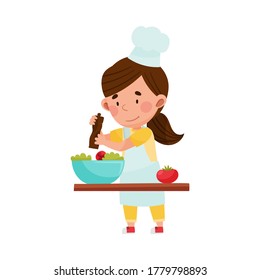 Cute Girl Character in Hat and Apron Standing at Kitchen Table and Dressing Salad Vector Illustration