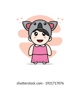 Cute girl character wearing koala costume. Mascot design concept