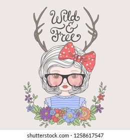 Cute girl with deer horns, sunglasses, floral wreath, bow. Wild and Free slogan