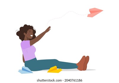 A cute girl in dress launches a paper airplane into the air and smiles. Vector illustration. The concept of communication, sending a message, mail.