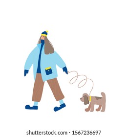 Cute girl dressed in loose trendy clothes walking with her dog. Female teenager wearing in cozy coat, woolly cap, knitted gloves  with her puppy isolated on white background. Vector flat illustration.