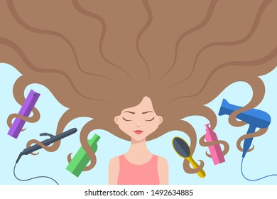 Cute girl with eyes closed and with long loose brown hair flowing around. Different hair care accessories are nearby and intertwined by curls. Concept of haircare, healthy hair and beauty treatments