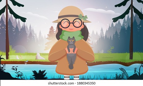 A cute girl in a hat and glasses stands in the forest and holds a small cat in her arms. Vector illustration.