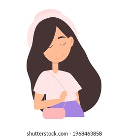 A cute girl in a hat and with a handbag.