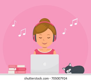 Cute girl with headphones listening to music and working on a laptop. Chat, dating, education, blogging and search for information on the network.