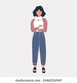 A cute girl is holding a doggie in her hands. The concept of loving a pet. Spitz. 