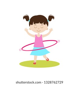 Cute girl with hula-hoop.Children physical activities outdoors.