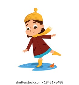 Cute Girl Jumping in Puddle Wearing Rubber Boots, Happy Kid Playing Outdoors in Autumn Cartoon Style Vector Illustration