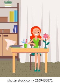 Cute girl making paper origami during creativity or schooler development lesson. Crafts classes for children and adults. Cartoon style paper flower and bird on desk. Craft hobby or profession