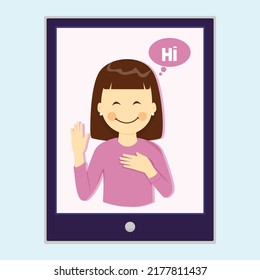 Cute girl on a laptop screen She waves during an online meeting with friends or family.