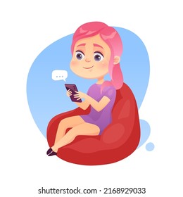 Cute girl with pink hair sitting on a bean bag uses a smartphone