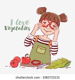 Cute girl playing with vegetables. Happy kid having fun making salad in the kitchen, holding pepper slices as glasses