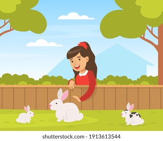 Cute Girl Playing with White Rabbits on Green Lawn, Kid Interacting with Animal in Petting Zoo Cartoon Vector Illustration