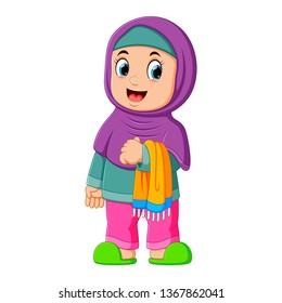 the cute girl with purple veil is standing and holding her prayer rug