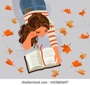 Cute girl reads a book