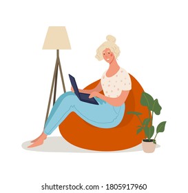 A cute girl sits in an armchair and works on a laptop. Remote work, online education, home office, online meeting with friends, online shopping. Flat cartoon vector illustration isolated on white