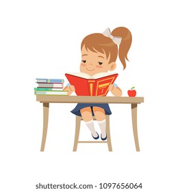 Cute girl sitting at the desk and reading a book, elementary school student in uniform vector Illustration on a white background