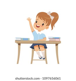 Cute girl sitting at the desk and rising her hand, elementary school student in uniform vector Illustration on a white background