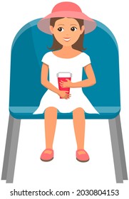 Cute girl sitting on chair and watching show. Little female character in viewer seat looking at performance. Toddler with drink in plastic cup in audience, spectator sitting on viewer place