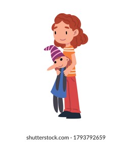 Cute Girl Standing with Pinocchio Wooden Boy, Adorable Kid Playing with her Favorite Toy Cartoon Vector Illustration on White Background