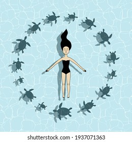 Cute girl swimming in the ocean with turtles circling around. Summer. Relax