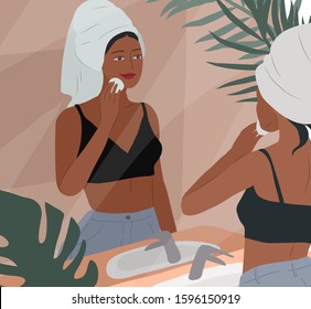 Cute girl with towel on head care for her skin after bathing, cleanses face and makeup. Feminine Daily life by young woman in bathroom interior with homeplants. Cartoon vector illustration