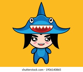 A cute girl wearing shark costume