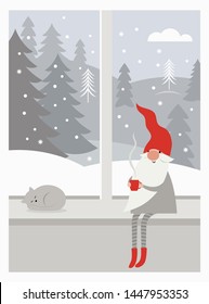 Cute gnome in red hat and in striped stockings is sitting on window sill , drinks hot tea, winter landscape outside the window, Christmas card concept, Merry Christmas