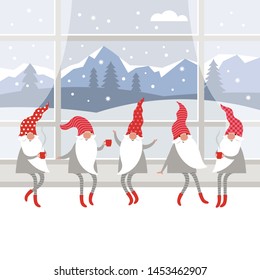 Cute gnomes in red hats and in striped stockings is sitting on window sill , drinking hot tea. Winter landscape outside the window, Christmas card concept, Merry Christmas