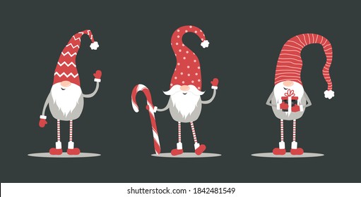 Cute gnomes in red santa hats on black background. Swedish christmas elves. Vector illustration in cartoon style. Nordic element design for greeting cards, season greetings, web, wrapper.