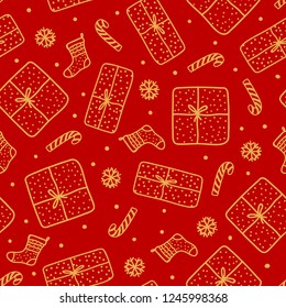 Cute gold Christmas seamles pattern. Handdrawn Gift box and santa sock, candy cane isolated on red background. Design texture holiday.