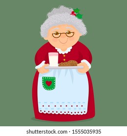 
Cute grandmother with cookies and milk