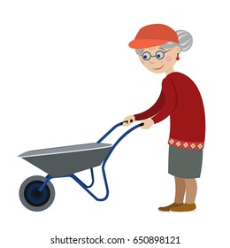 Cute grandmother with a garden wheelbarrow