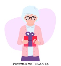 Cute grandmother holds a gift in her hands. Female pensioner personage making surprise. Aged, elderly woman giving wrapped gift box. Old lady Isolated concept vector illustration in cartoon flat style