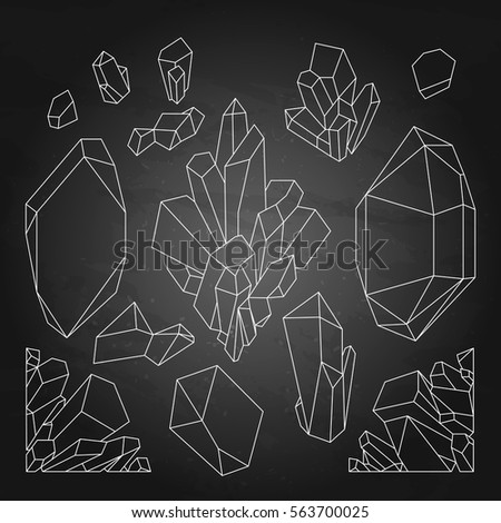 Cute graphic crystals drawn in line art style and isolated on the chalkboard