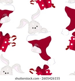 A cute gray bunny rabbit sits in a Santa Claus hat and red gift box with candy around in seamless pattern.