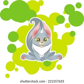 Cute gray kitten on background with green circles